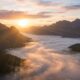 Sunrise over mountains above clouds, cremation services in Gilbert, AZ